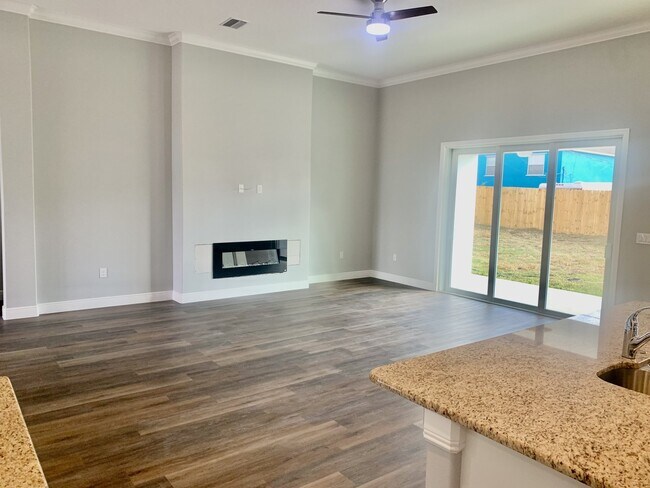 Building Photo - "Spacious 4-Bedroom 3-Bath with In-Law Suite & Granite Finishes in Palm Bay!"
