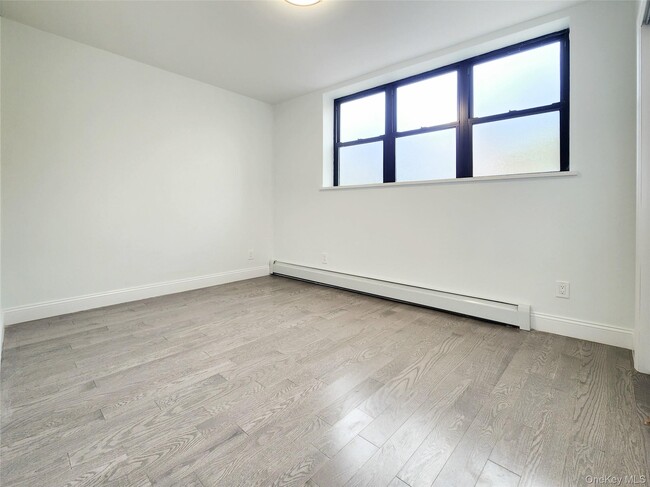 Building Photo - 76-12 Woodside Ave