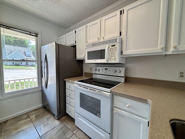 Building Photo - Don't Miss This Spacious Wake Forest Townhome with Dual Primary Suites!