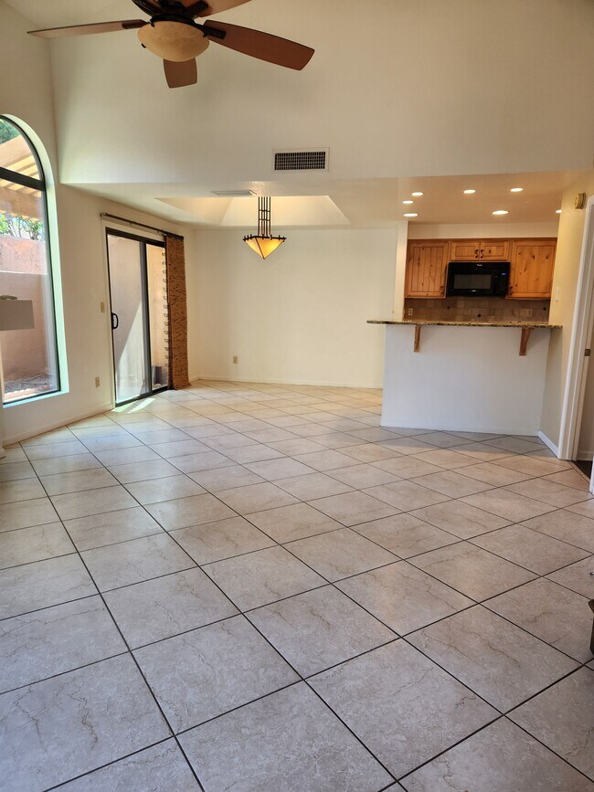 Living room, dining room , kitchen - 5640 E Bell Rd