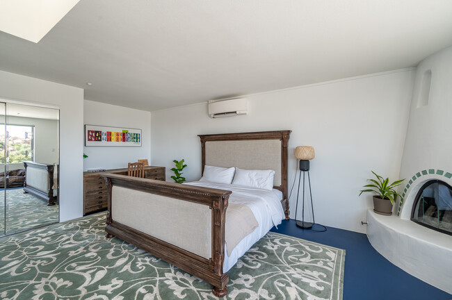 Master bedroom with RH king bed, desk, and Kiva fireplace - 7401 Studio Rd