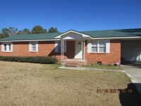 Building Photo - 4 Bedroom and 2 bathroom Brick Home