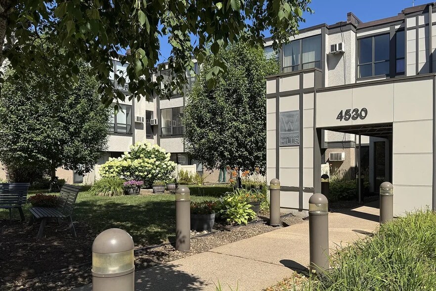 Front of building with unit window - 4530 Park Commons Dr