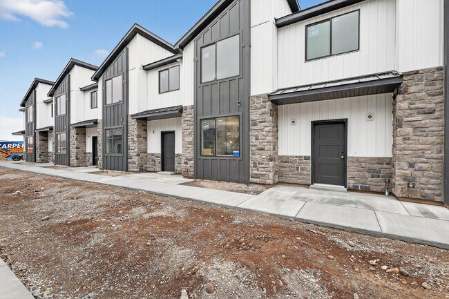 Building Photo - $300 off first month for February move-ins - BRAND NEW 3 BED 2.5 BATH TOWNHOMES WITH 2 CAR GARAGE
