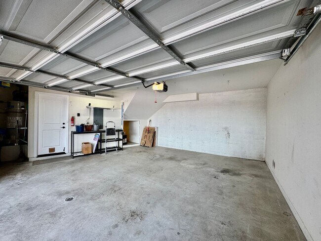 Building Photo - Beautifully Remodel Townhouse with AC & Two Car Garage!