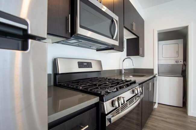 Building Photo - APPS ON US! Modern & Sleek One-Bedroom Tow...