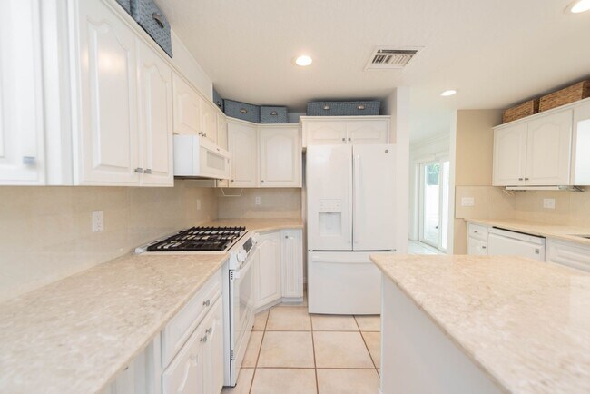 Building Photo - Live the ultimate Space Coast waterfront lifestyle at this stunning beachside canal home in Satel...