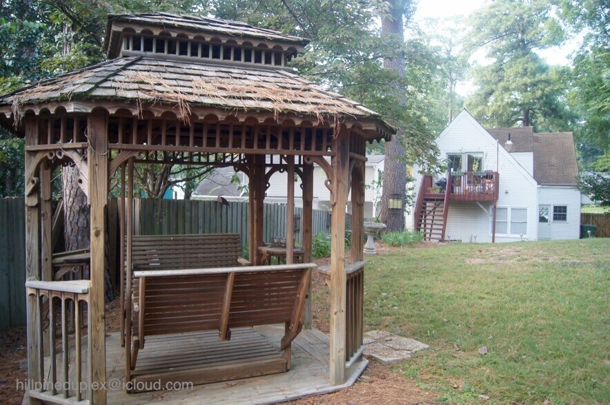 Spacious backyard with gazebo, firepit, patio, and plenty of space for a small garden. - 629 Hillpine Dr NE
