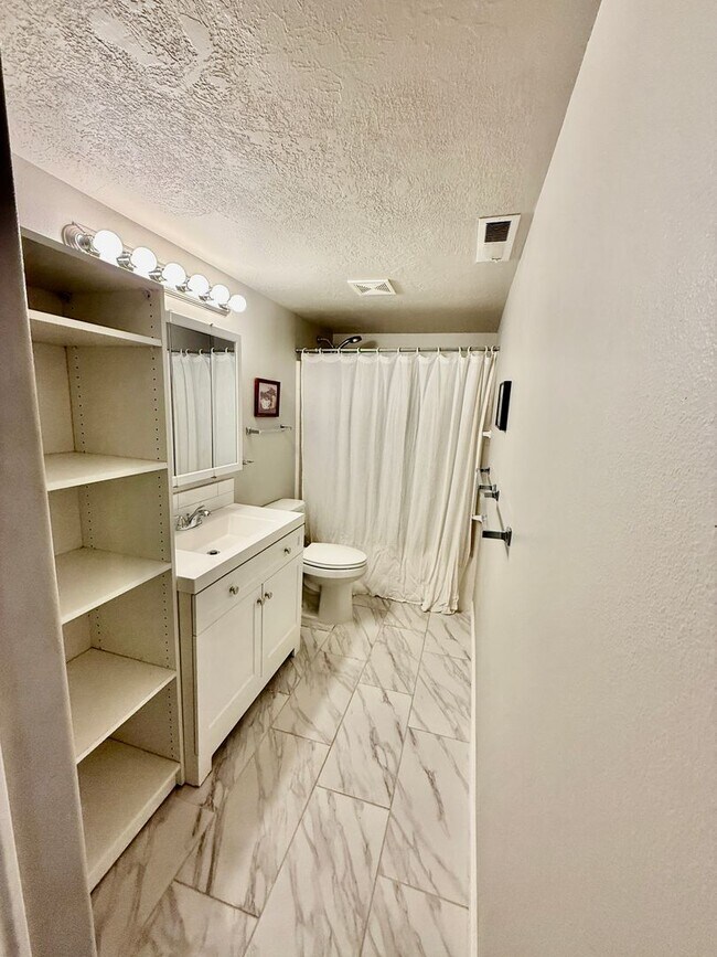 Building Photo - Furnished and Utilities Included: Two-Bedroom Basement Apartment with Private Yard