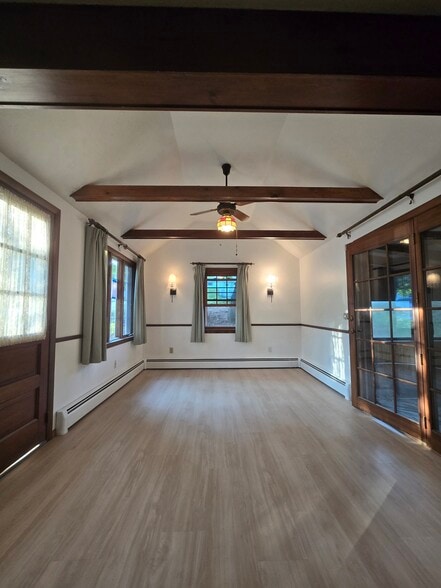 Vaulted dining room with screened in porch - 1280 S Beech St