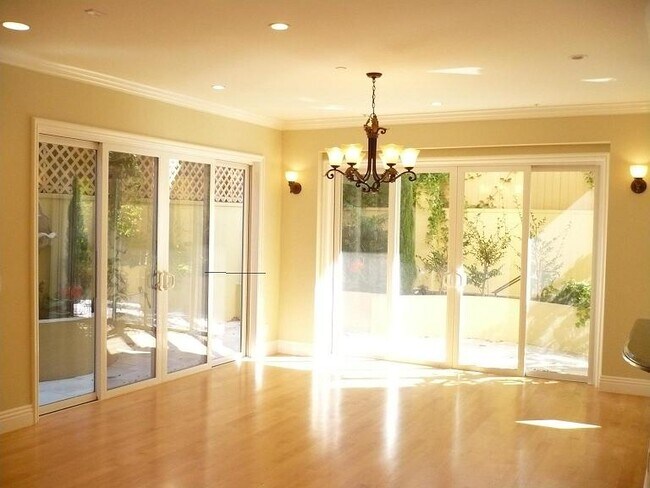 Dining/ living area with sliding doors - 1540 S Bentley Ave