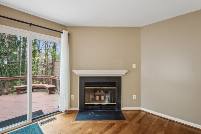 Building Photo - Modern Brick End-Unit Townhome with Stunning Upgrades and Serene Wooded Views