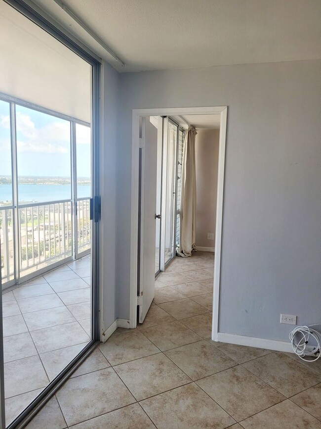 Building Photo - AVAILABLE | 2 Bedroom, 1 Bathroom Condo with 1 Assigned Parking Stall