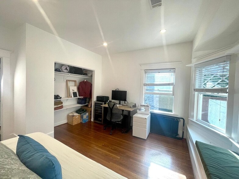 Sun-filled space perfect for a bedroom or work-from-home setup. - 6000 Carlton Way