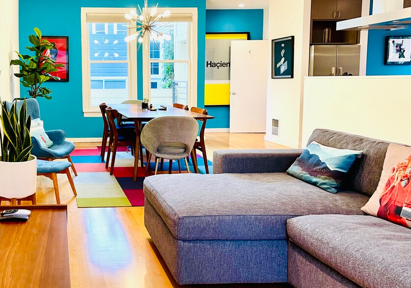 Large open living room & dining area w/ high ceilings, large windows, plenty of light - 328 Harriet St