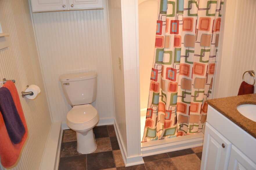 old staging of toilet cubby and roomy lighted shower - 222 W Case St