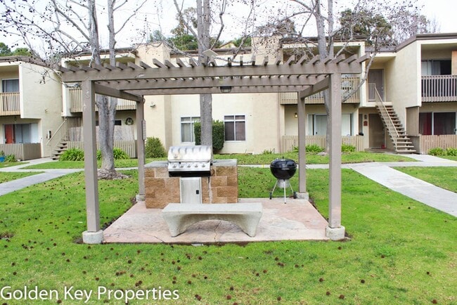 Building Photo - Cozy ground-level unit in the gated commun...