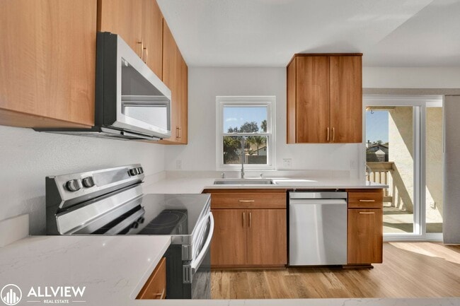 Building Photo - Modern 1-Bed Upstairs Condo with Garage & ...