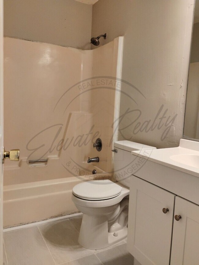 Building Photo - Two Bedroom Townhouse with deck near Trini...