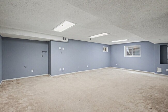 Building Photo - Updated 4BR Corner Lot Home with Finished Basement & 2-Car Garage