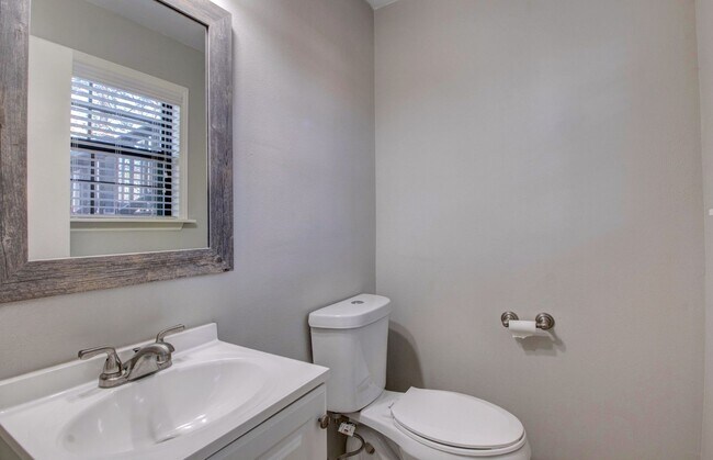 Building Photo - Welcome Home: Charming Brick Beauty with Covered Porch.