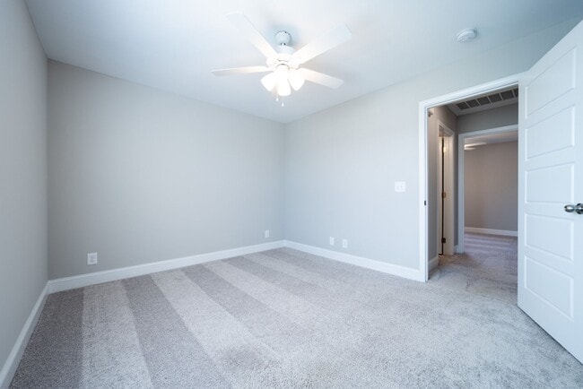 Building Photo - Elegant Home with Stone Fireplace, Kitchen Island and Designer Primary Suite