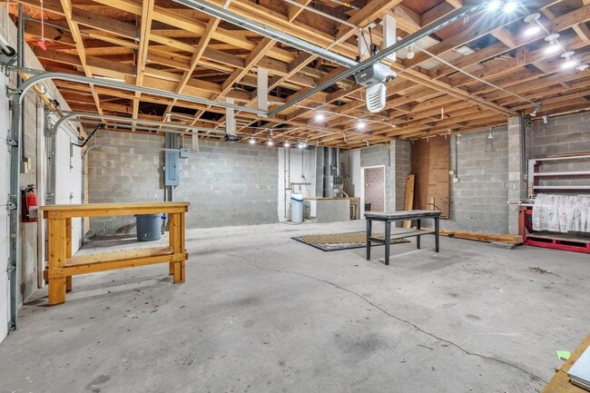 Building Photo - Charming home with large garage & attached...