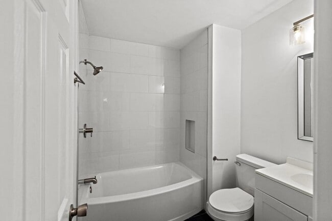 Building Photo - Completely Remodeled 2BR/1.5BA Townhome – City Convenience!