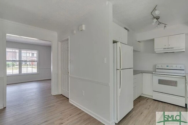 Building Photo - Spacious 2-Bedroom Brick Townhome with Private Fenced Yard