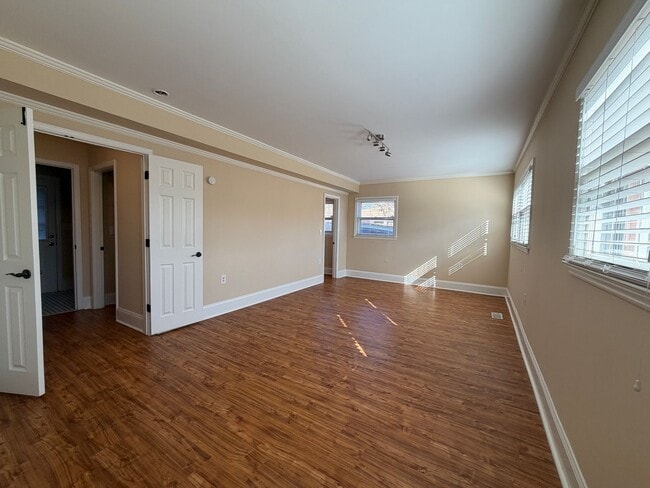 Building Photo - Freshly Painted Split-Level Home with Large Deck & Lawn Care Included