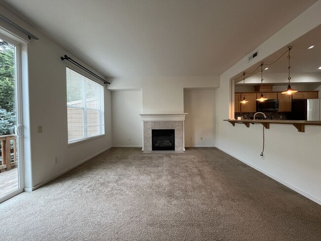 Building Photo - Beautiful 2 Bedroom Townhome with Walk-In Closets Private Deck & Attached Garage