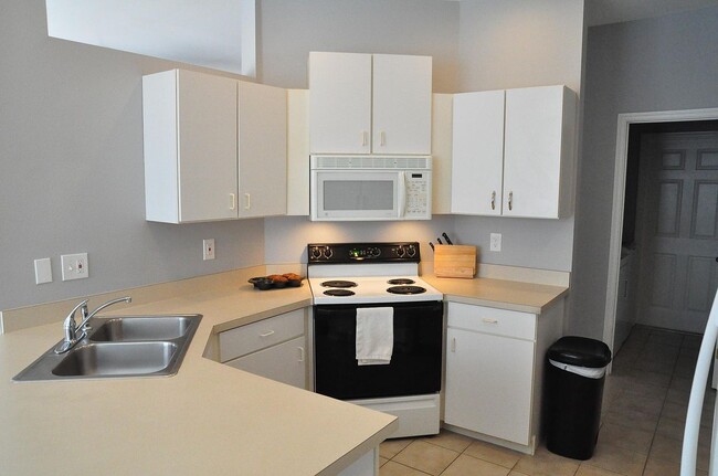 Wrap-around kitchen. Good counterspace. Layout is very accessible. - 5009 46th St W