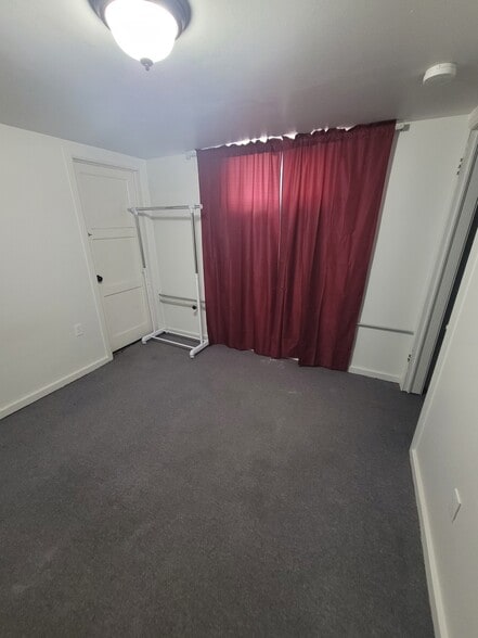 Bedroom with clothes rack - 481 S 100 E