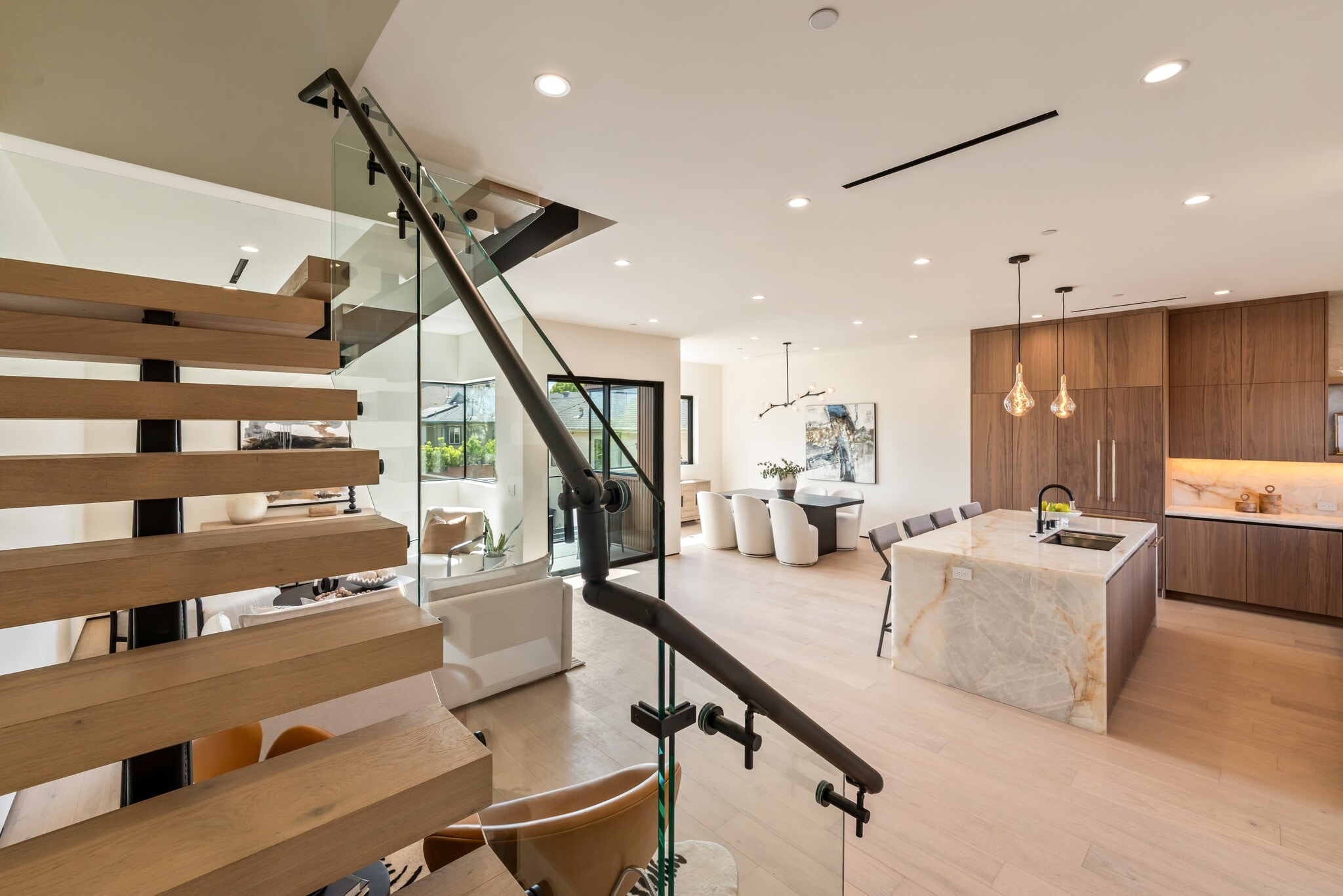 Floating stairs with glass railing leading to the bedroom level - 836 Waterloo St
