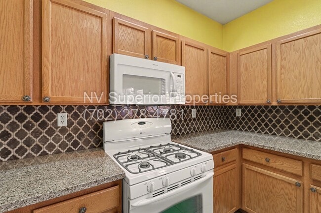 Building Photo - NW!! 4 Bedrooms!!! All Tile and Pergo flooring T/O!! NO Carpet!!! Low Maintenance Desert landscap...