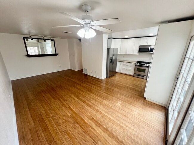 Building Photo - Stunning 4BR Townhome with Hardwood Floors, Private Patio, Community Pool & 2-Car Garage!
