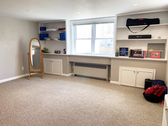 Den with ample sunlight and bookshelves - 110 Dobson St