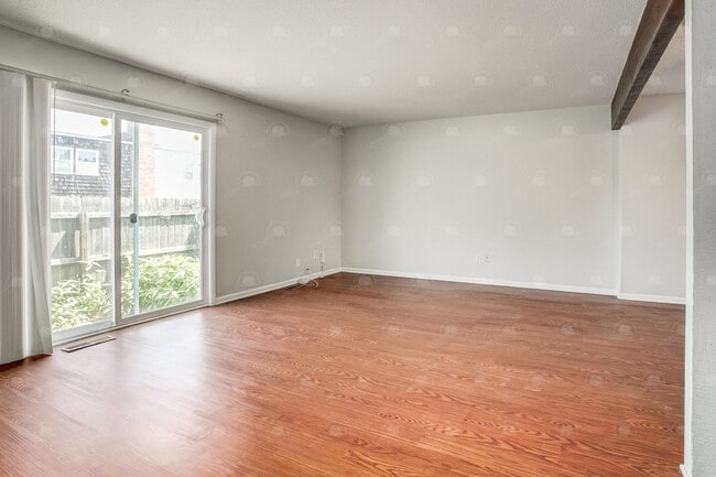 Building Photo - **Spacious 3-Bedroom Townhome with Partially Finished Basement and Off-Street Parking**