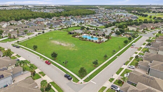 Building Photo - Spacious 6-Bedroom Home Near Lake Nona | 3-Car Garage + Tesla Charger