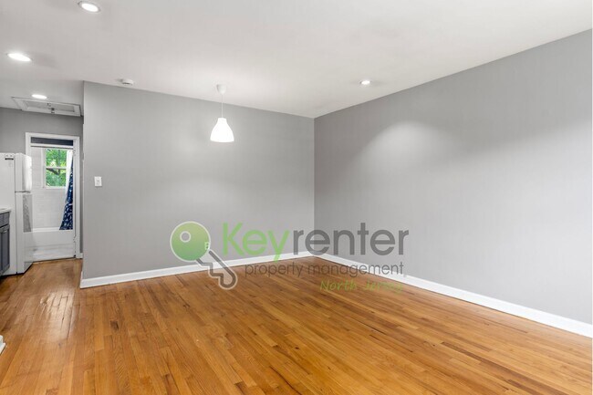 Building Photo - Quiet 2nd-Floor 1BR Condo – Updated Bath, Pet Friendly & Easy NYC Commute