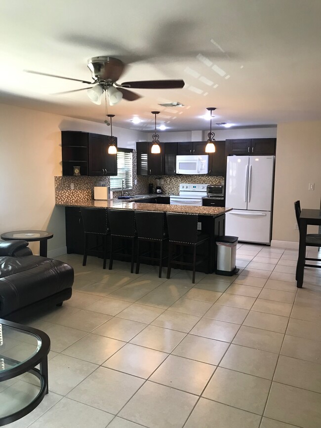 kitchen open to living room - 1473 NE 48th St