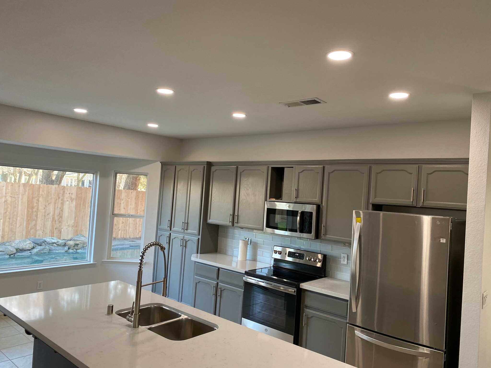 kitchen; new lighting - 1134 Pine Ct