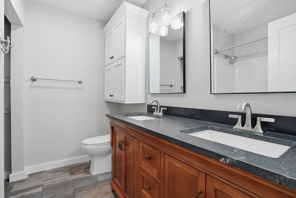 Hall bath (Ample storage above toilet and in linen closet to left) - 14548 W 19th St S