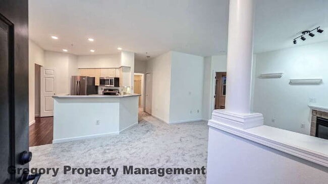 Building Photo - Sunlit & Spacious Ground-Level Condo | 12-Foot Ceilings, Luxury Amenities & Ideal Locale