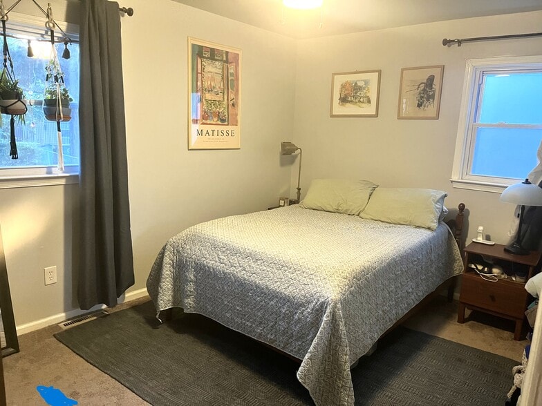 primary bedroom with ensuite half bathroom - 4020 Piney Rd
