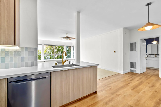 New luxury vinyl wide-plank flooring in kitchen, dining room and bathroom - 2221 Ocean Ave