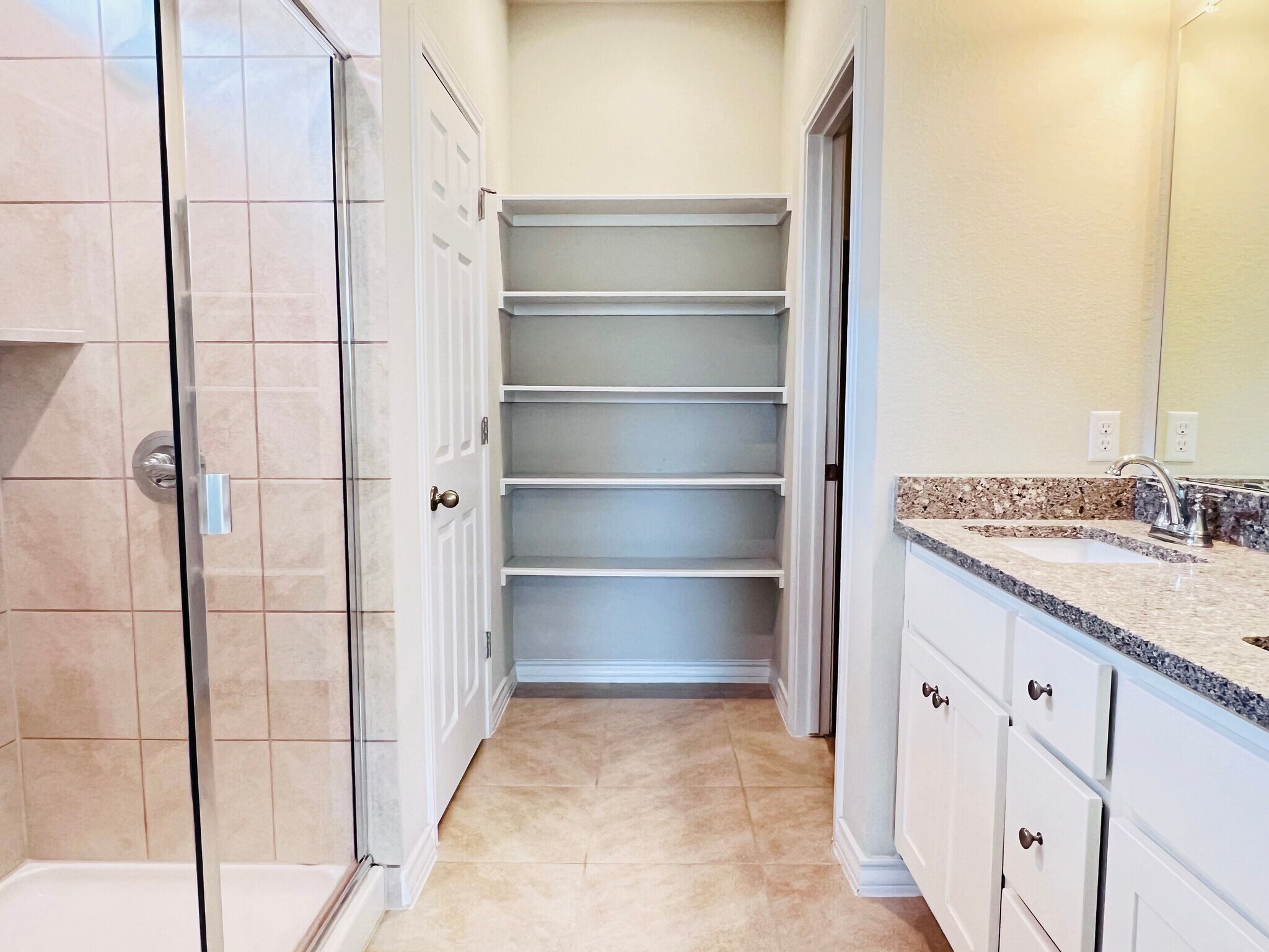 Primary bathroom with built-ins and double vanity - 12112 Coyote Call Way