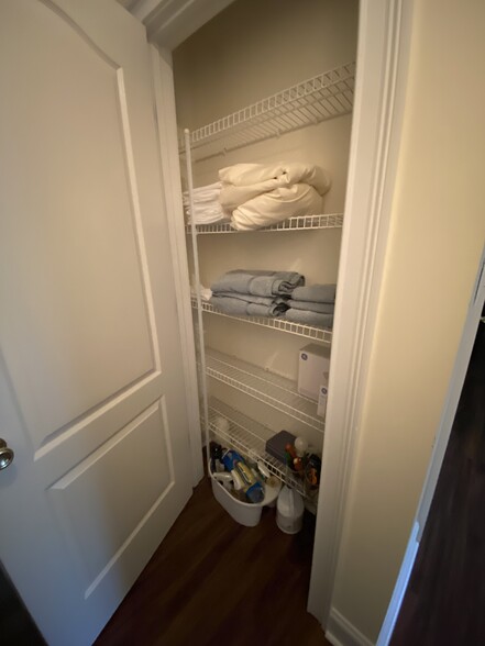 Linen closet with towels and sheets. - 600 Mitchell Bridge Rd