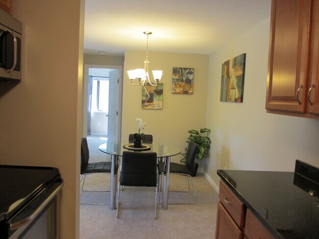 View from kitchen to dinning area - 25 Village Rock Ln