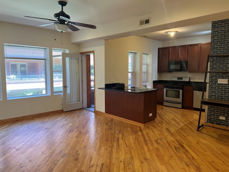 Living Room & Kitchen & Balcony - Greenleaf-Paulina Apartments